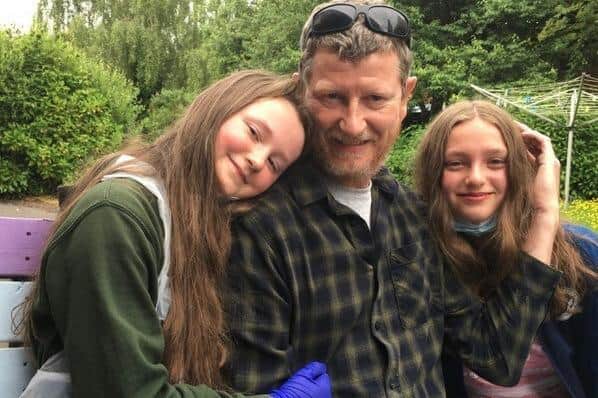 Howard Holden, who suffered unexplained heart failure in his sleep at his home in Oswaldtwistle, Lancashire, in April 2020, with his daughters Tilly, left, and Daisy