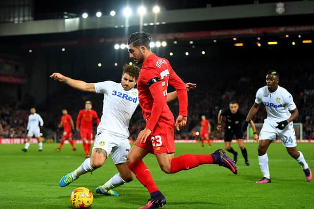 Leeds United defender Gaetano Berardi challenges Liverpool's Emre Can. Pic: Laurence Griffiths.