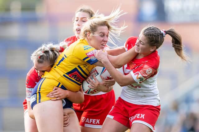 Leeds Rhinos’ Chloe Kerrigan is tackled by St Helens’ Paige Travis, Isabelle Rudge and Tara Jones in last year’s Betfred Super League Grand Final. Picture: Allan McKenzie/SWpix.com.