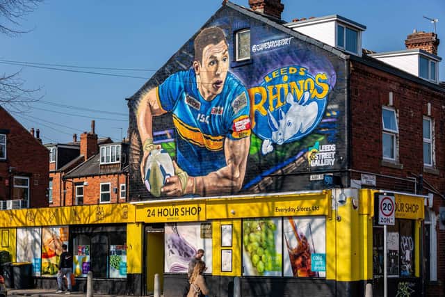 The mural depicts Kevin, 41, in his Leeds Rhinos kit with a ball in hand on the side of a shop near the club's Headingley Stadium.
cc SWNS
