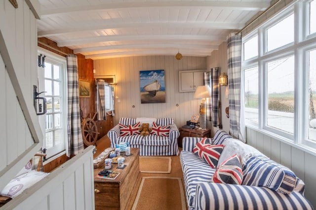 This cosy living room gives plenty of room for families to relax after a long day at the beach.