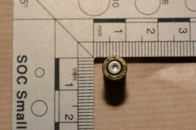 A bullet casing recovered from the scene of the kidnapping on Glossop Street.