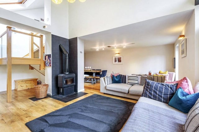 The open plan living space is really the hub of the home. The living space is fitted with Karndean flooring and Jotul 2000 blue/black enamel wood burning stove.