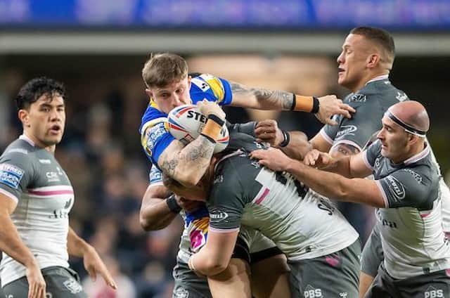 Rhinos' Liam Sutcliffe is tackled by Jack Brown, Kane Evans and Danny Houghton. Picture by Allan McKenzie/SWpix.com.