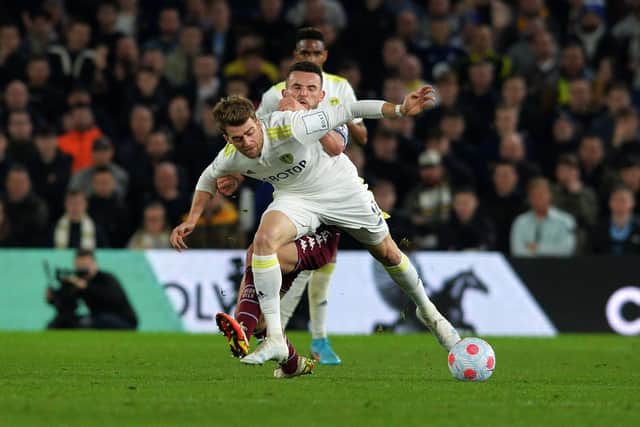 WELCOME RETURN: For Leeds United striker Patrick Bamford, front, pictured twisting and turning Aston Villa's John McGinn who found himself booked for fouling the Whites striker. Picture by Jonathan Gawthorpe.