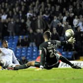 THE LAST LAUGH: Jermaine Beckford, centre, who had earlier been denied by a fine save from Fraser Forster, right, finally beats the Norwich City 'keeper to net a dramatic winner that sent Leeds United top of League One back in October 2009. Picture by Simon Hulme.