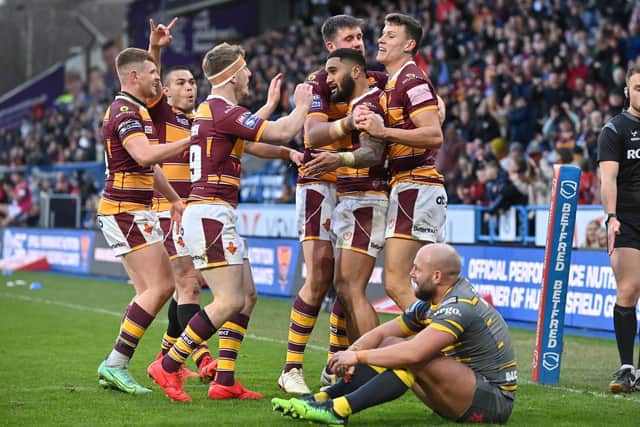Giants celebrate Ricky Leutele's third try as Paul McShane reflects on another Tigers defeat. Picture by Bruce Rollinson.