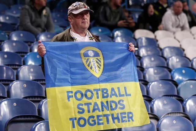 A Leeds United fan shows solidarity with Ukraine during the home game against Aston Villa. Photo: George Wood