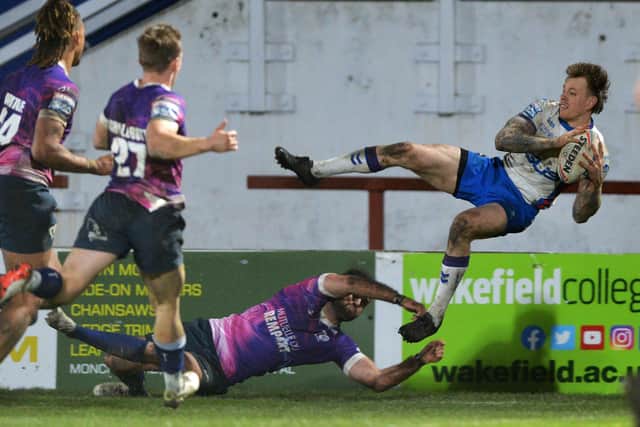 Tom Johnstone throws the ball back in for Corey Hall to score Wakefield's third try.  Picture Bruce Rollinson