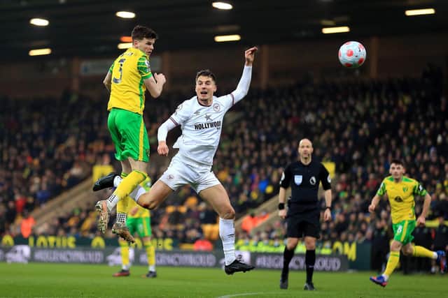LATE CHECK: To be made on Norwich City's former Leeds United right back Sam Byram, left, ahead of Sunday's Premier League clash against the Whites at Elland Road. Photo by Stephen Pond/Getty Images.