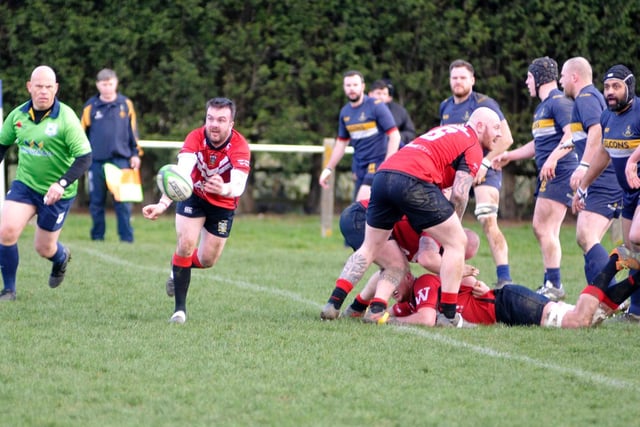 Scrum-half Josh Walker moves the ball out.