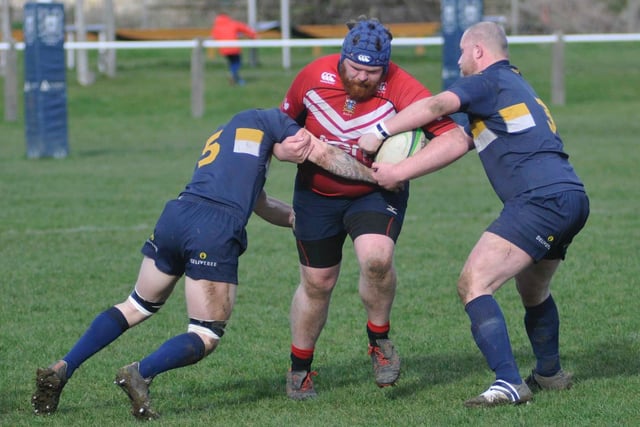 Prop forward Josh Hough takes on two Old Crossleyans players.