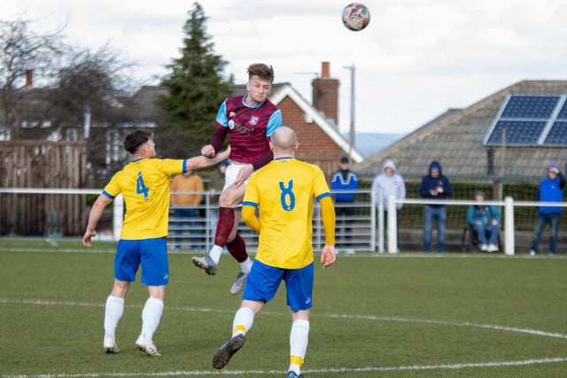 Joe Jagger heads the ball on for Emley AFC.  Picture: Mark Parsons