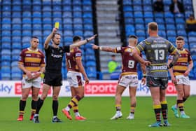Referee James Child shows a yellow card to Castleford's George Lawler (not pictured) during the Tigers' 36-24 defeat at Huddersfield. Picture: Alex Whitehead/SWpix.com.