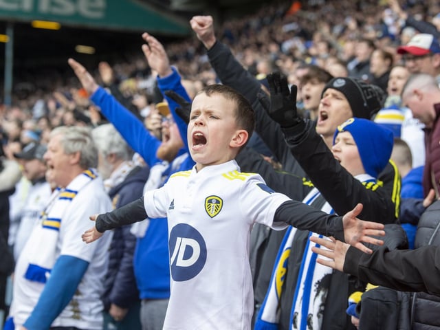 A young Leeds fan singing with heart.