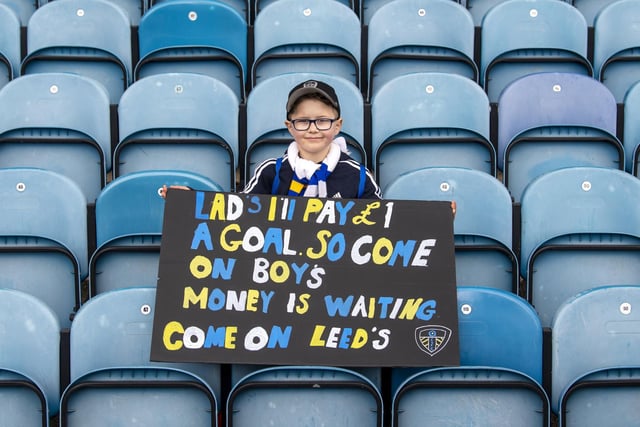 A young fan with a plea for the Whites players before kick off.