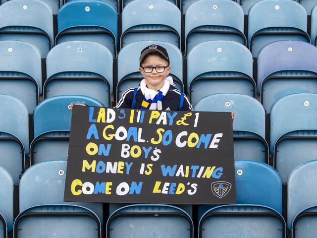 A young fan with a plea for the Whites players before kick off.