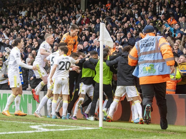 The Leeds United players celebrate Joe Gelhardt's last-minute winner with the fans.