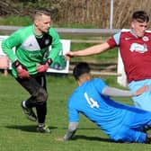 Hassan Abrar, of Alwoodley, stops a shot from Littletown's Jordan Ledgard during Saturday's Yorkshire Amateur Supreme division encounter. Picture: Steve Riding.