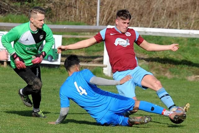 Hassan Abrar, of Alwoodley, stops a shot from Littletown's Jordan Ledgard during Saturday's Yorkshire Amateur Supreme division encounter. Picture: Steve Riding.