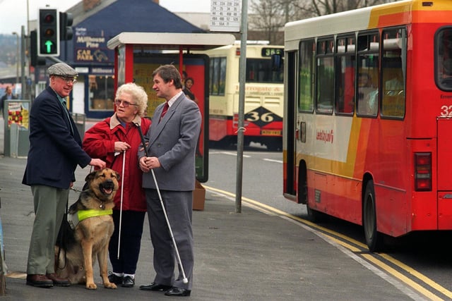 Campaigners were celebrating victory in the battle to save free bus passes for the blind in Leeds. Pictured at a city bus stop is, from left, Alan Oldroyd, Vice Chairman for the Federation of the Blind for Leeds, with his guide dog, Costa, campaigner, Ivy Needham and Federation chairman Barry Naylor.