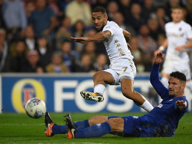Kemar Roofe gets a shot in at goal despite the challenge of Cardiff City's Sean Morrison during the Championship clash at the Cardiff City Stadium in September 2017.