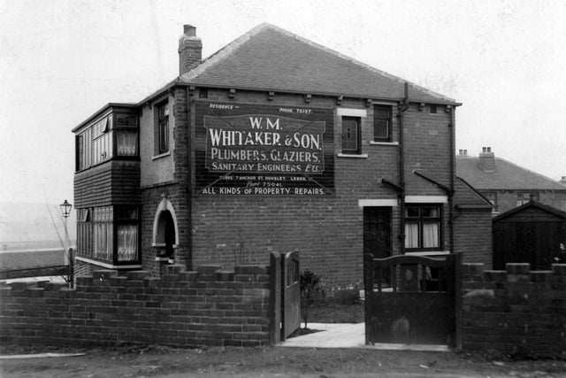 Dewsbury Road in February 1937 and pictured is the home of W.M.Whitaker, plumber. A painted sign to side of house advertising the services of Mr. Whitaker has red line markings edited to photograph by city engineers, implying sign had been put up without permission.