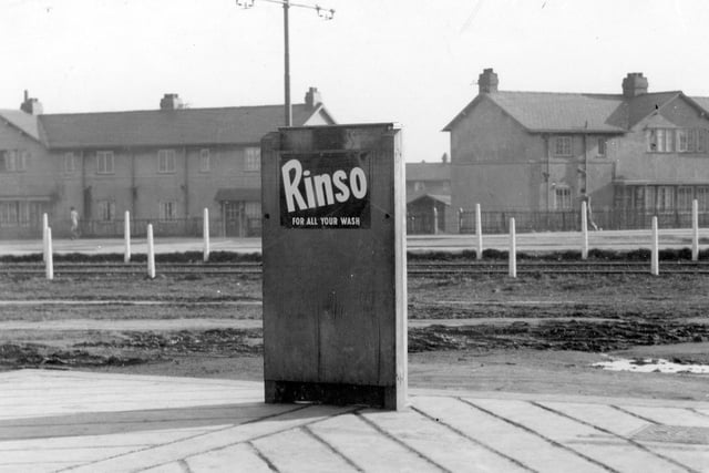 Tramlines on Middleton Park Road with houses in the background in February 1937. The main focus of the photograph is a rectangular object (possibly a tram timetable) which has an advertisement for Rinso on the back.