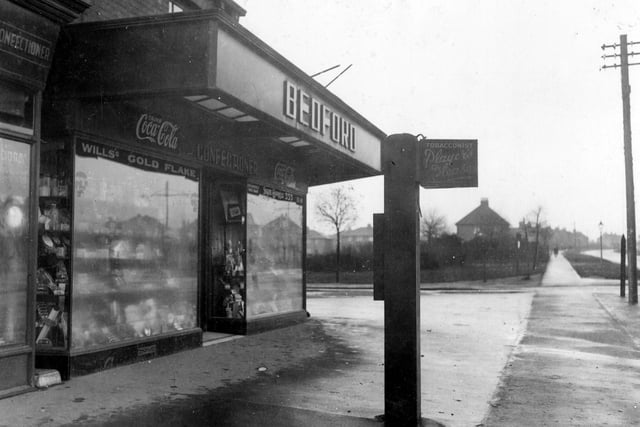 Bedford Confectioners shop on corner of Middleton Park Road with Middleton Park Circus. Goods can be seen displayed in shop windows.
