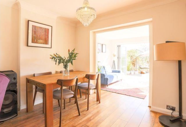Through an archway is the dining space which offers enough room for a family dining table.