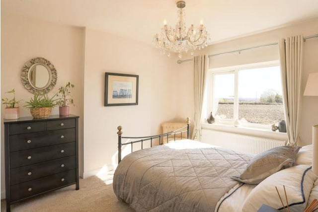 Upstairs are three bedrooms with views across the countryside.