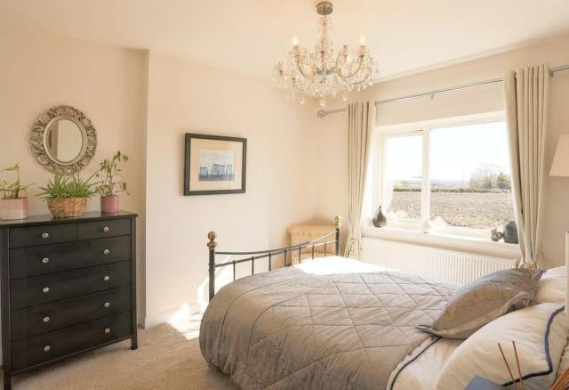 Upstairs are three bedrooms with views across the countryside.