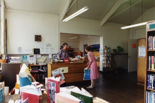 Inside  Meanwood Branch Library which was housed in Bentley Primary School on Bentley Lane. This view looks from the adult library towards the counter with the children's library in the background. The library has since closed down.
