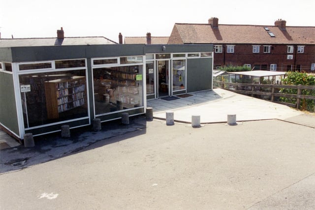 Swillington Branch Library on Wakefield Road. The rear of terraced housing facing onto St. Mary's Avenue can be seen on the right.