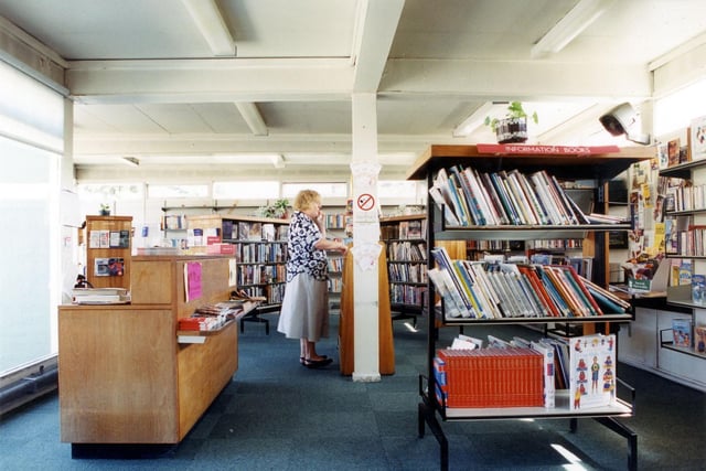 Inside Swillington Branch Library on Wakefield Road. The counter is on the left with children's information books on the right.