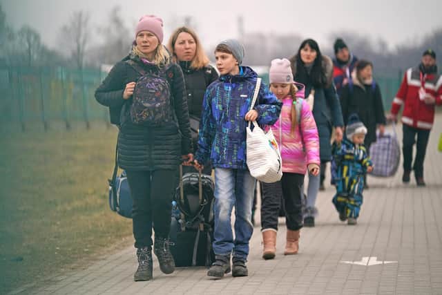 People crossing the border point from Ukraine into Medyka, Poland. Photo: PA Wire/PA Images