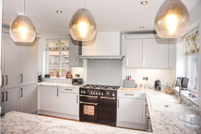 The modern kitchen has fitted appliances and a Rangemaster cooker.