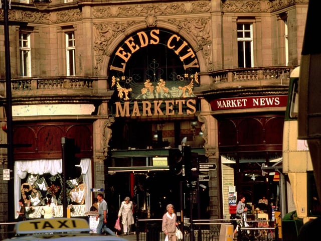 The entrance to Kirkgate Market on the corner of Vicar Lane with Kirkgate. This part of the market was opened in 1904 and was designed by competition winners, John and Joseph Leeming of Halifax.