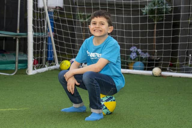 Since being diagnosed, aged just five, Ryly has continued to enjoy his life, including playing for his local football team. Picture: Tony Johnson.