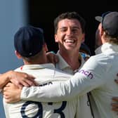 England's Matt Fisher celebrates his first test wicket, the dismissal of John Campbell of West Indies. (Photo by RANDY BROOKS/AFP via Getty Images)