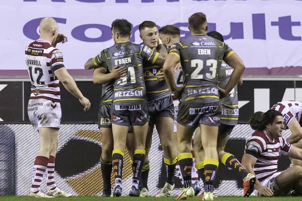 Picture by Allan McKenzie/SWpix.com - 17/03/2022 - Rugby League - Betfred Super League Round 6 - Wigan Warriors v Castleford Tigers - DW Stadium, Wigan, England - Castleford's Jake Trueman is congratulated on scoring a try against Wigan.