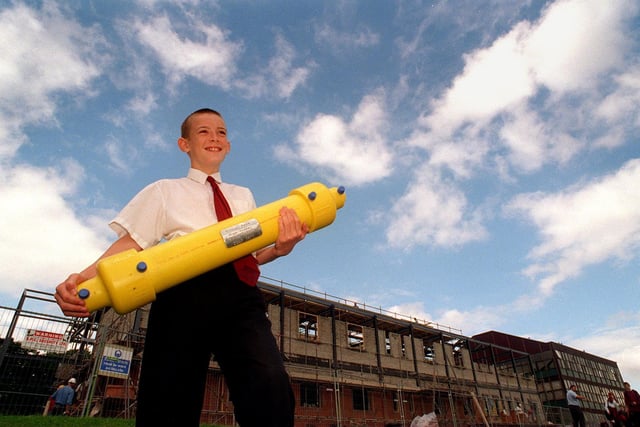 July 1997 and Farnley Park High was burying a time capsule to mark the completion of a new school building. Pictutred with the capsule in front of the new block is David Thompson.