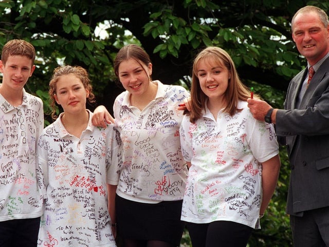 May 1999 and Farnley High School deputy head Mal Hughes, signs the shirt of Louise Deery. Looking on, from left, are Antony Wilkinson, Ian McCarran, Lindsay Sharp, and Alaina Jessey.