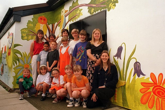 Children in front of mural they have produced at Old Farnley Community Centre in August 1996.