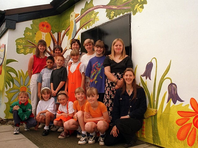 Children in front of mural they have produced at Old Farnley Community Centre in August 1996.