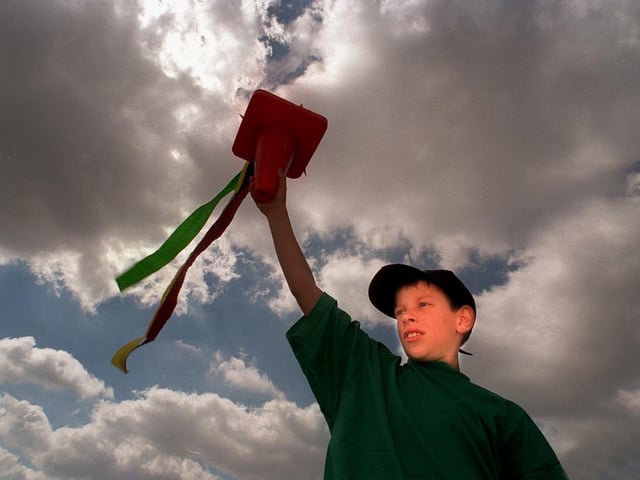 More than 250 pupils at Lawns Park Primary held a school Olympics opening ceremony in July 1996 with a pretend flame and a march with banners. Pictured is one of the torch bearers, pupil Warren Brewer, with a pretend Olympic flame.