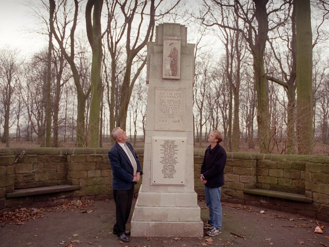 Local resident and organiser Carl Wise (right) and Coun Malcolm Bedford admire a new plaque on Farnley's war memorial in December 1999.