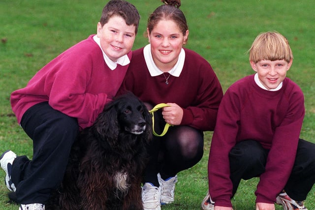 Three pupils from Farnley Park High School helped to sponsor a dog at the Canine Defence League in Eccup. Pictured, from left, is Danny Mc Cleland, Claire Popple and Adam Howarth with sponsored dog Max.