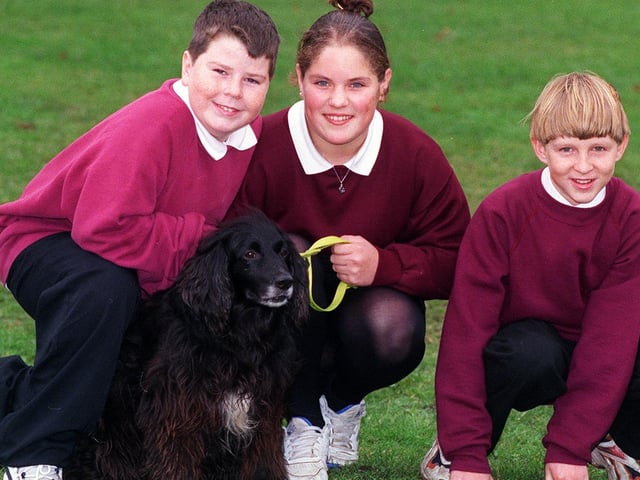 Three pupils from Farnley Park High School helped to sponsor a dog at the Canine Defence League in Eccup. Pictured, from left, is Danny Mc Cleland, Claire Popple and Adam Howarth with sponsored dog Max.