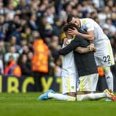 Rodrigo, Raphinha and Jack Harrison embrace at the final whistle after Leeds United beat Norwich City. Picture: Tony Johnson
